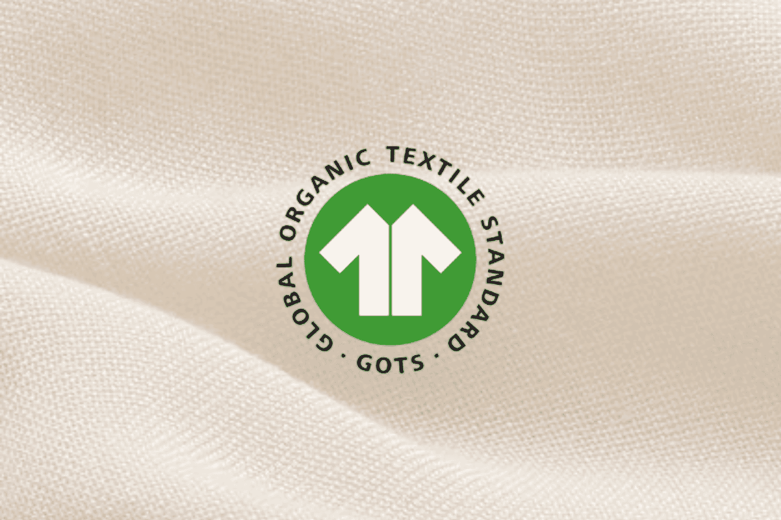Close-up of the GOTS logo on fabric showing GOTS certification for organic textile products.